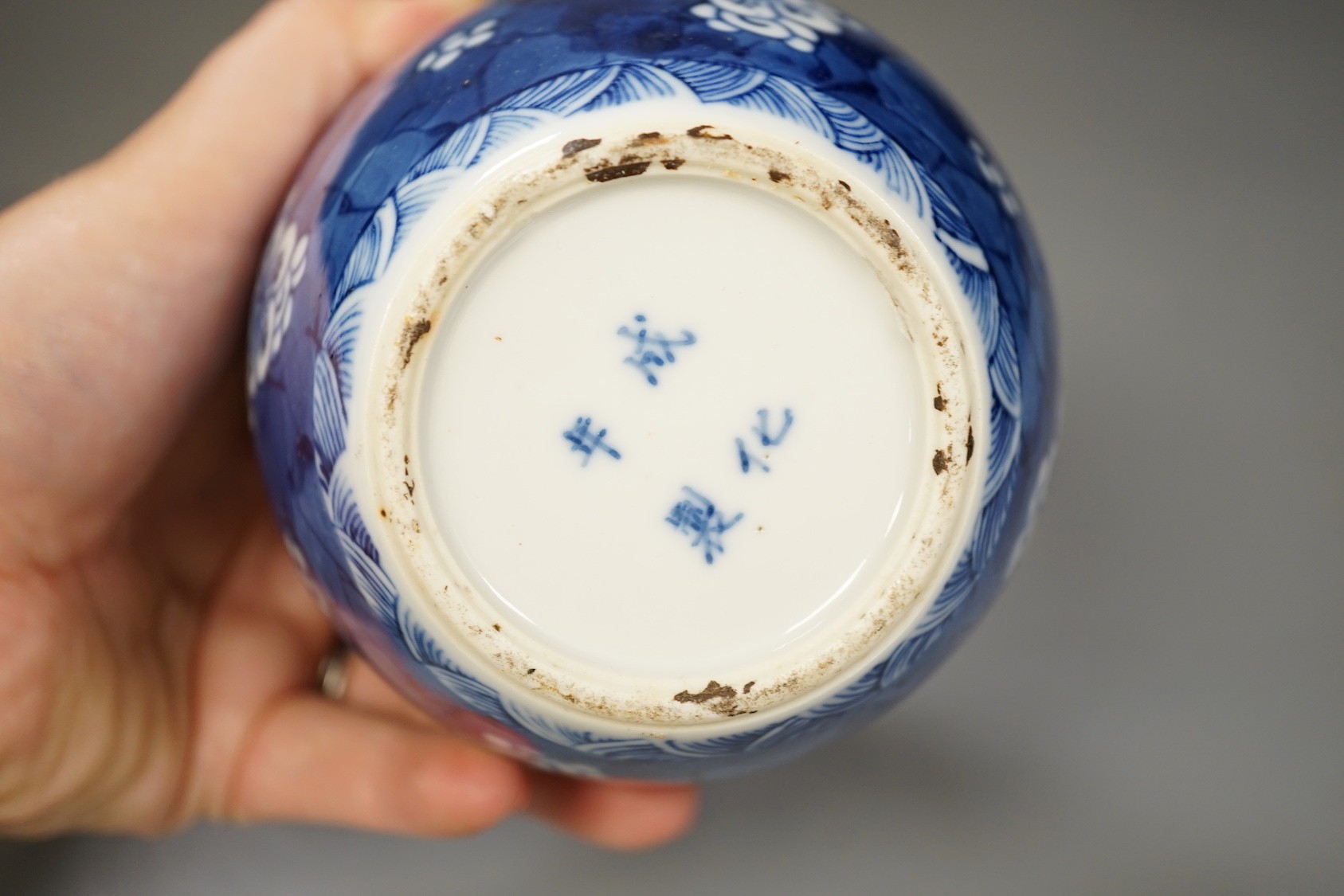 A Chinese powder blue bowl, early 18th century and a Chinese blue and white prunus jar - tallest 13cm